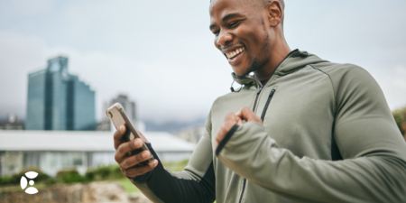 Man looking at fitness app on his phone